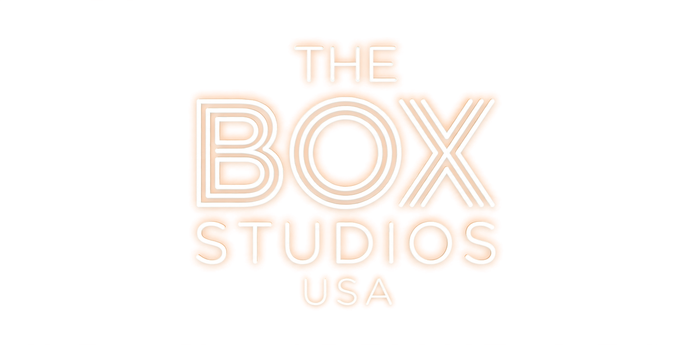 The Box Studios USA lockup in gold neon
